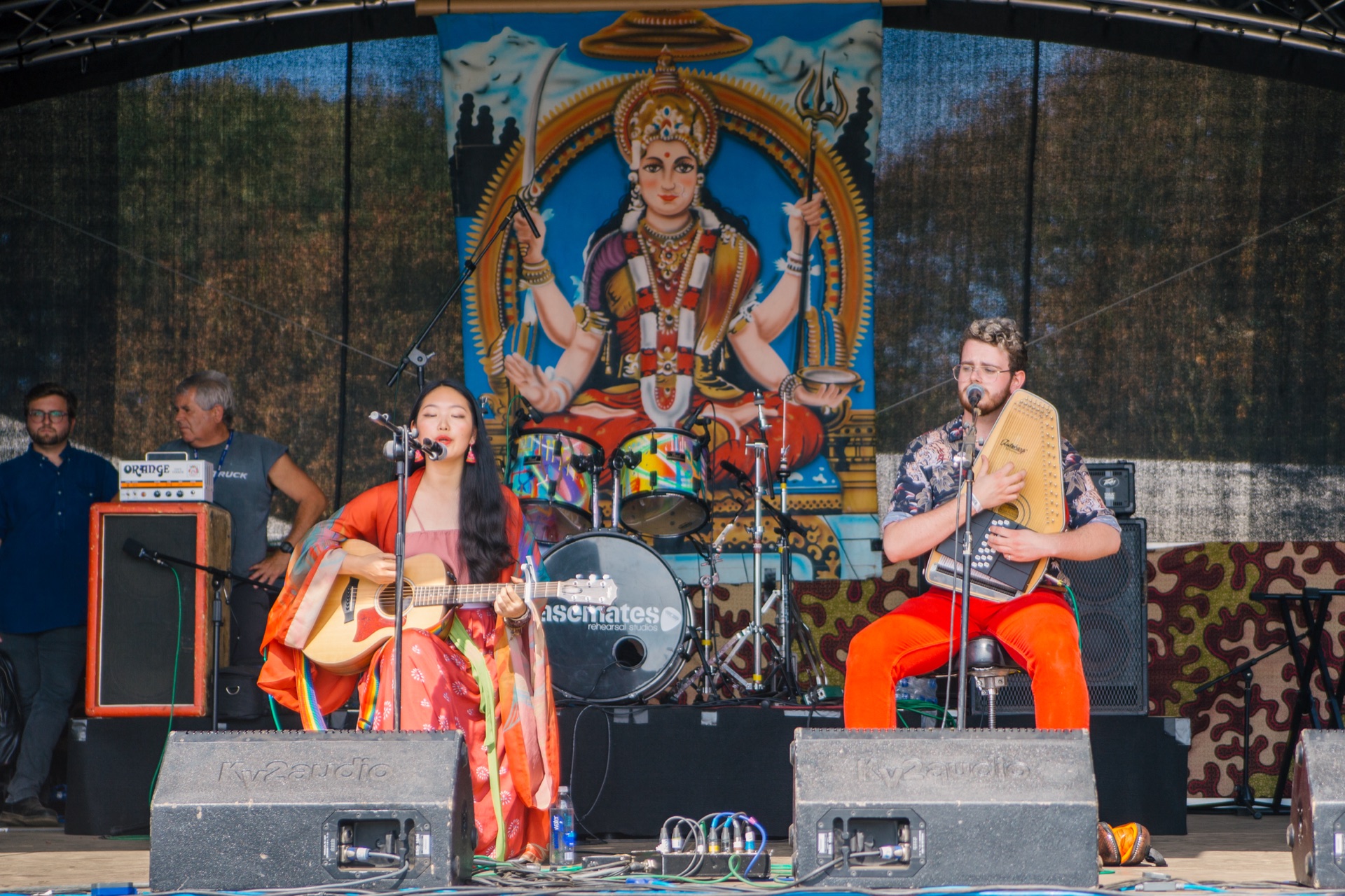 Yijia performing live on stage at a festival